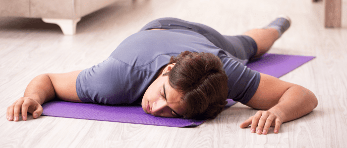 Man sleeping on his exercise mat