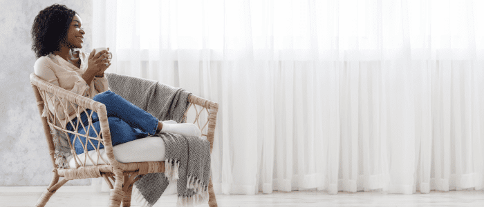 person relaxing at home in a chair