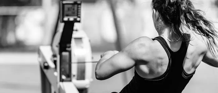 Woman training on a rowing machine
