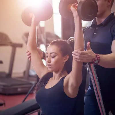 Woman performing a seated shoulder press