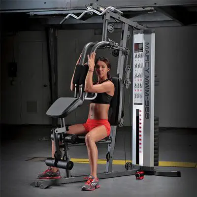 a marcy multi-gym being used by a woman
