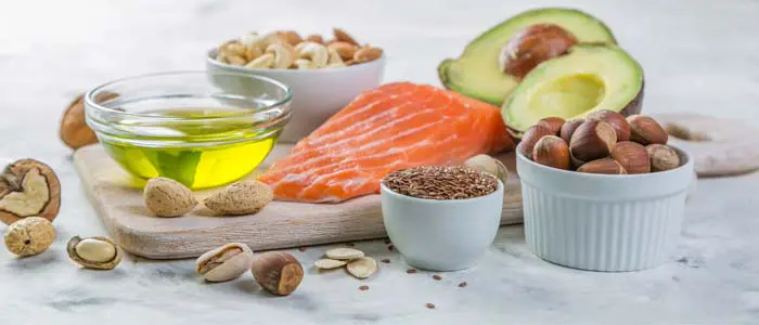 table of healthy fish, nuts and oils