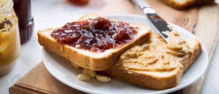 bread slices with jam and peanut butter on