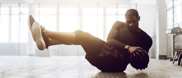 man working out with a medicine ball