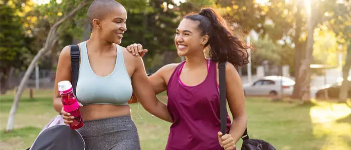 two women walking outside