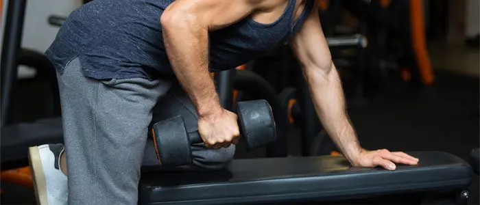 man doing dumbbell rows