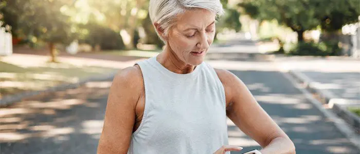 woman checking the time before her run