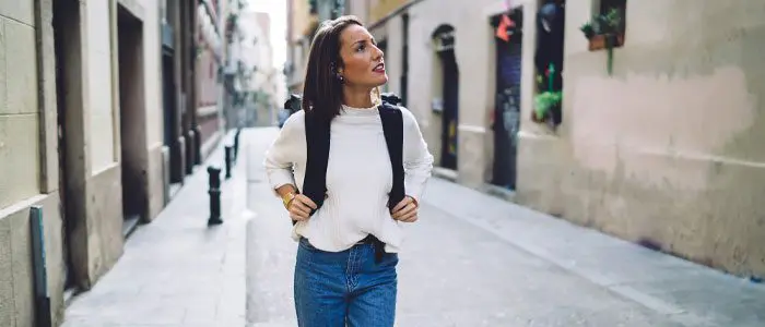 woman walking around a city