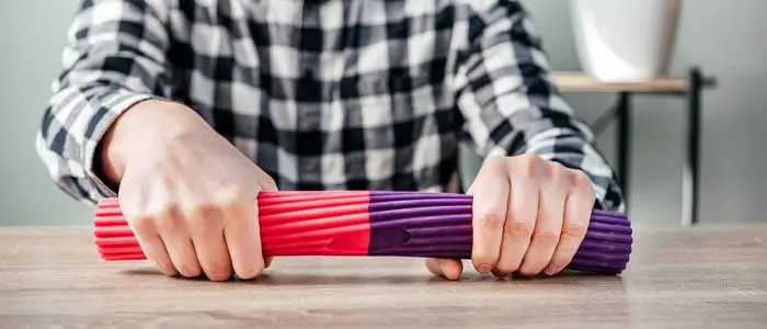 man doing twist wrist exercises for tennis elbow