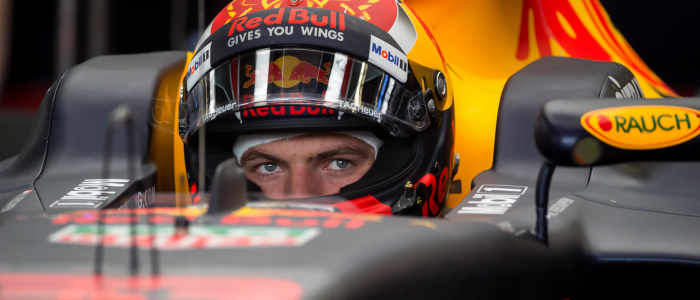 close up of an f1 driver in a race car